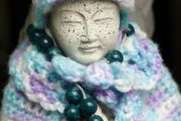 Prayer beads adorn many of the statues