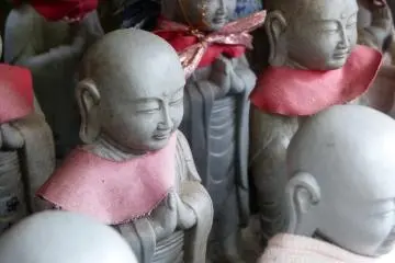 These statues are adorned with the traditional red found on most jizo statues