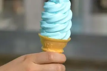 Blue soft serve ice cream is a popular item for tourists.