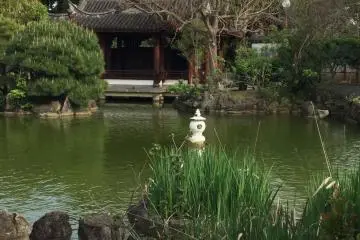 View of the entrance from the other side of the pond.