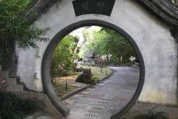 The walkway around the park is marked by several gates like this.