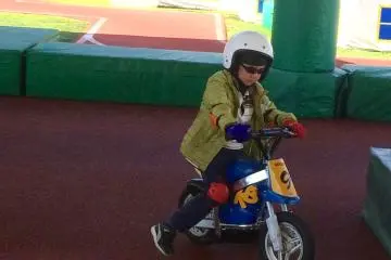 Our six year old at Mobi Park trying out a kids` motorcycle
