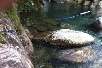 If you need help getting across the water, there's a handy rope to grip onto.