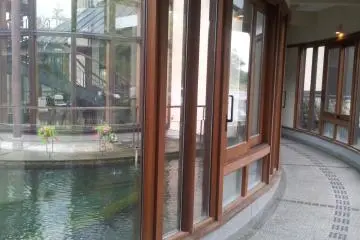 Glass and wood around the central pond