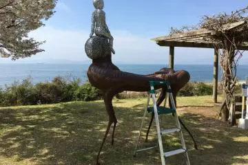 #90 Boy and Monster by Toshimitsu Isu is a sculpture that you are encouraged to interact with by climbing on. You need to drive to get to this artwork!