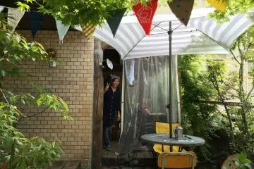 There is an outside terrace and an indoor living room bar area