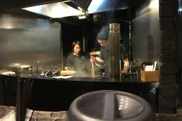 Watching the chef on his 'stage' and his ramen performance