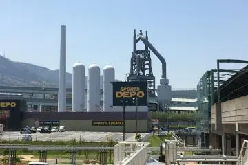 Exit the Space World train station and you will see the towers of the Higadashi Blast Furnace right behind the Sports Depot