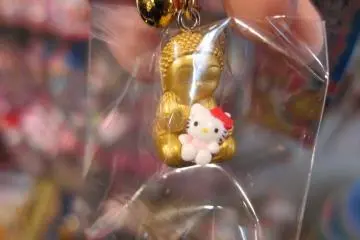 Hello Kitty cradled in Buddha's arms. This one takes the cake in terms of strangeness.