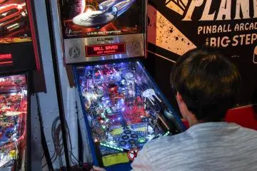Battling it out at the tournament over some Star Wars pinball.