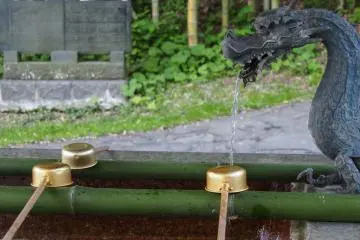 Water house at the torii gate to wash your hands.