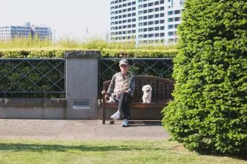 A local enjoying the sunny day here with his little dog