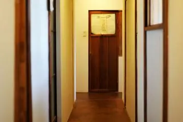 The hallway leading to the bathroom and rooms