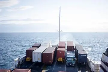 The ferry also transports container trucks
