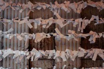 Some wishes are written and knotted on paper