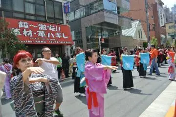 A full street full of dancers all in different costumes