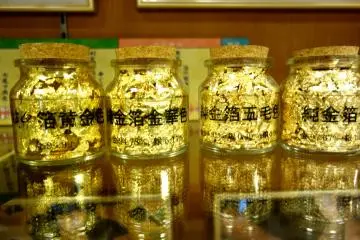 The offcuts of gold leaf squares do not go to waste