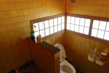 The spacious cubicle welcomes even the most timid of bottoms to take a seat
