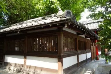 The main shrine building sits quietly in the midday sun
