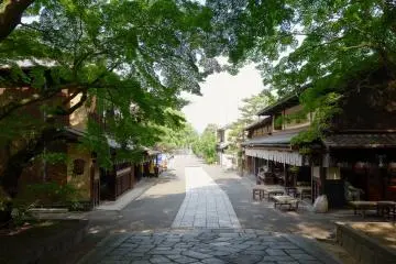 The road out the Shrine's east gate, where Ichiwa and Kazariya aburi-mochi sweet shops await your patronage