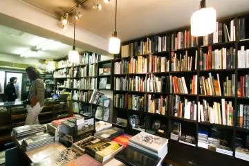 A tourist checking out the bookstore