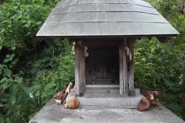 A side shrine attended by some small animals