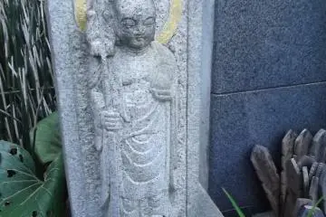 A smaller statue near the Kannon