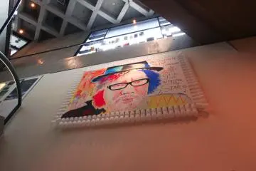 An illustration of Sion Sono in the basement of Watari-um