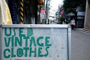 Many signboards on ground level advertise about basement stores or those on upper floors