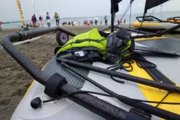 The dinghy sits quietly in the rainy weather. It is designed to be lightweight and durable