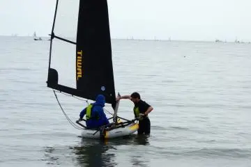 A man is given lessons on how to operate the Tiwal during a free trial session 