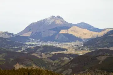 A patchy late-winter Mt. Yufu&nbsp;rises above Yufuin