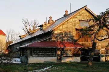 Rustic farm houses litter the landscape.