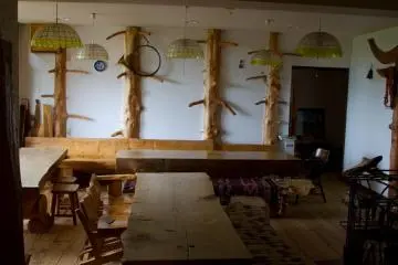 Handcrafted wooden tables in the common room