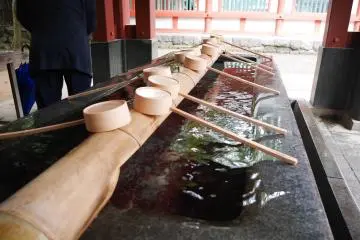 The shrine's temizuya (hand purification fountain) is just outside the shrine's central court