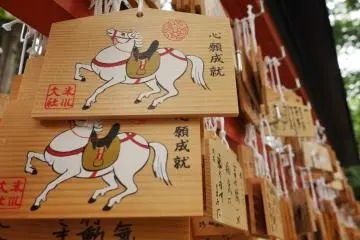 Emas written with hopes for the future hang in several locations around the shrine 