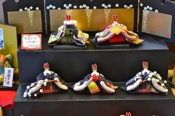 Hand-made dolls on display at a store