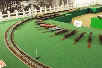 Many different train cars and engines