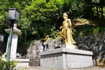A gold buddha amongst the stone