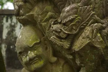 This ornate statue features an impressive dragon