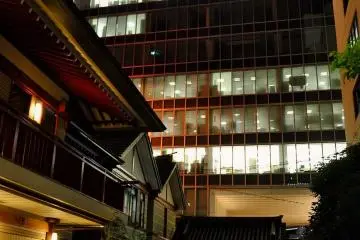 The shrine's lights compete with office towers