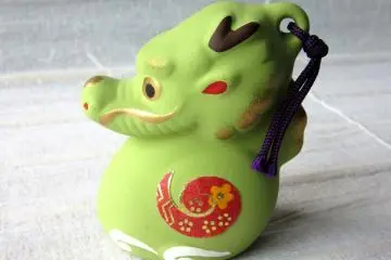 Tetsu (a dragon) was year 2012. Another version of a souvenir is a ceramic bell.