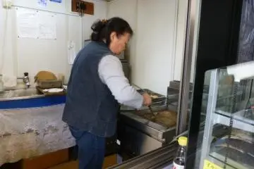 Street vendor preparing oysters