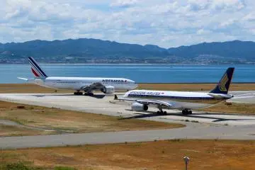 Two planes getting ready for take off.
