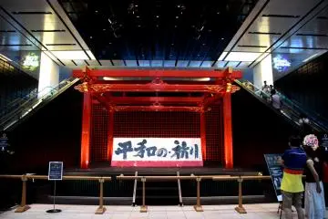 Noh dance stage. The sign says 'Prayer for peace'.