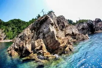 The scenery is a mix of stone and vegetation