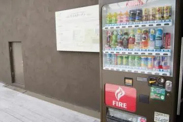 A vending machine near the entrance to the garden