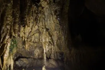 A limestone formation illuminated from below