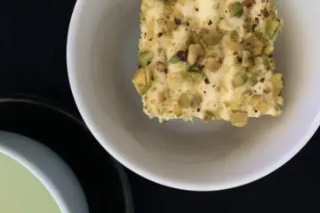 Pistachio topped cake in Business Class
