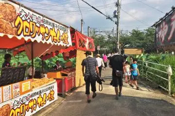 Tons of stalls, which seem to comprise most of the actual festivities, line the streets to the shrine